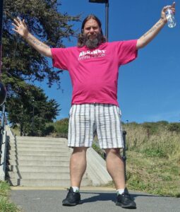 Lee in a pink Against Breast Cancer t-shirt whilst training for his fundraising challenge.