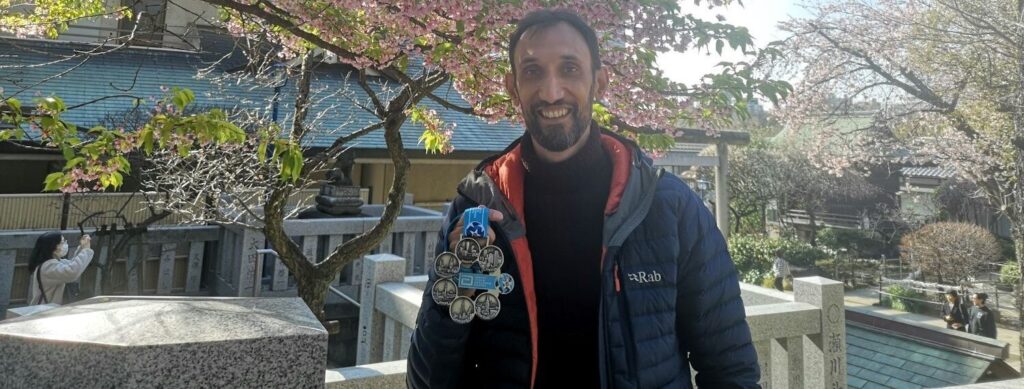 Nicholas Raj in Tokyo with his Six Star Medal awarded for completing for the Abbott World Marathon Majors.