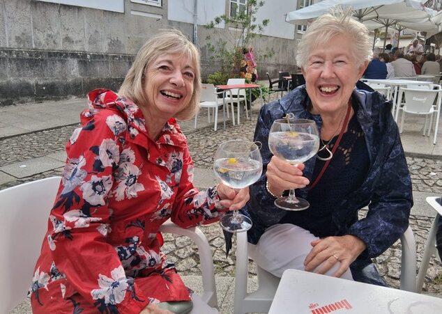 Ann and Rosemary raise a glass during their Camino from Tui to Santiago de Compostela.