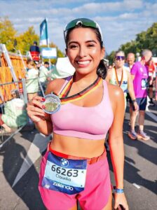 Claudia holding her medal