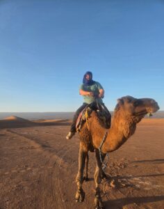 Lee ticks off a bucket list item by riding a camel in the Sahara Desert