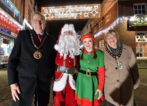 The mayor (left) and mayoress (right) of Hinckley with Brian dressed as Santa and Hannah as one of his elves.