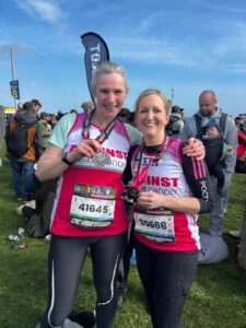 Joanne Roberts and Kimberley Ryder with the Brighton Marathon medals