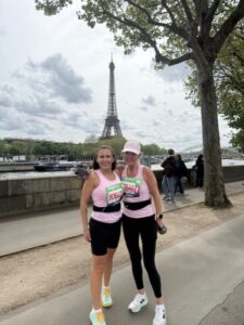 Marta Len and another person with the Eiffel Tower in the background