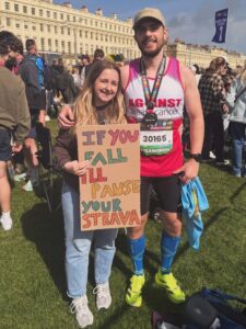Oli with another person after running the Brighton Marathon