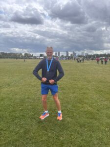 Kevin with his medal after the race in Hackney Marshes