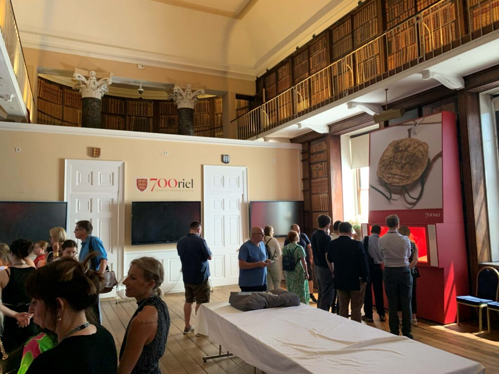 Research Conference attendees visit the Oriel College, Oxford 700th Anniversary exhibition.